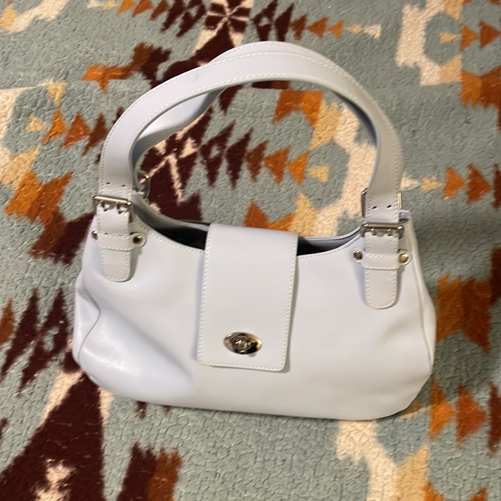 Leather Talbot purse never worn , was in my closet , very nice and pretty color